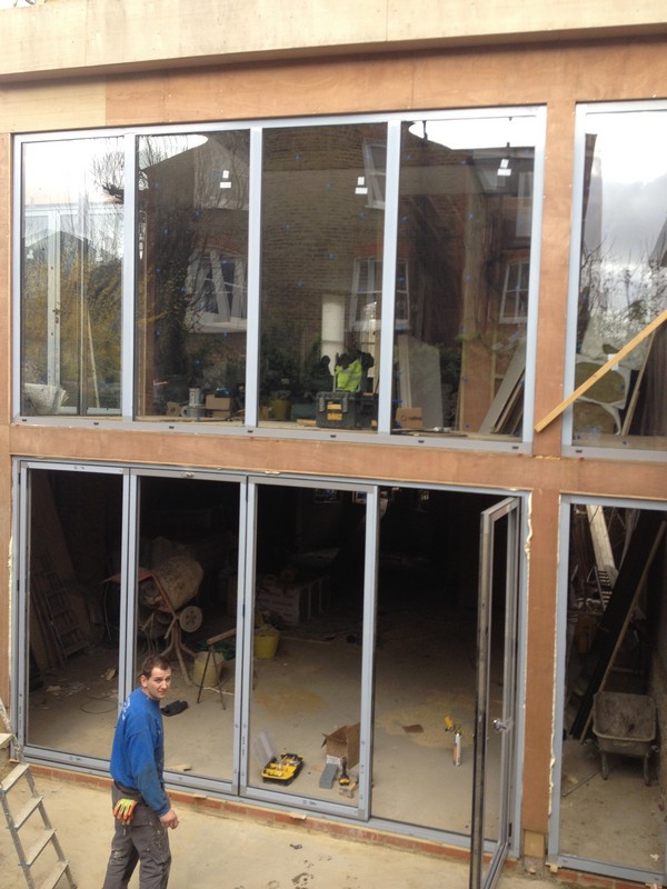Aluminium bi-fold doors with two-storey glazing in Kilburn